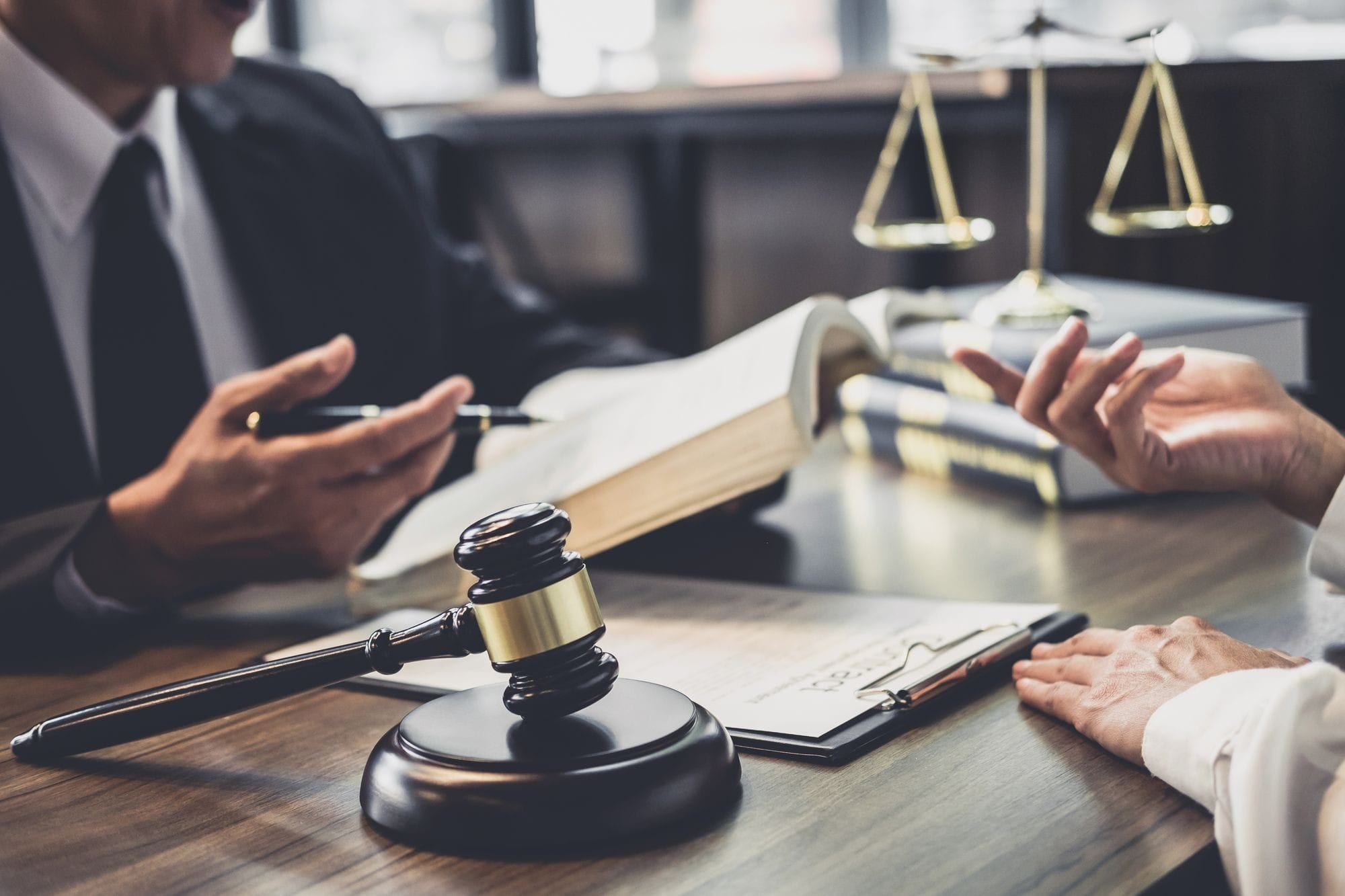 Male Lawyer Having Team Meeting With Client